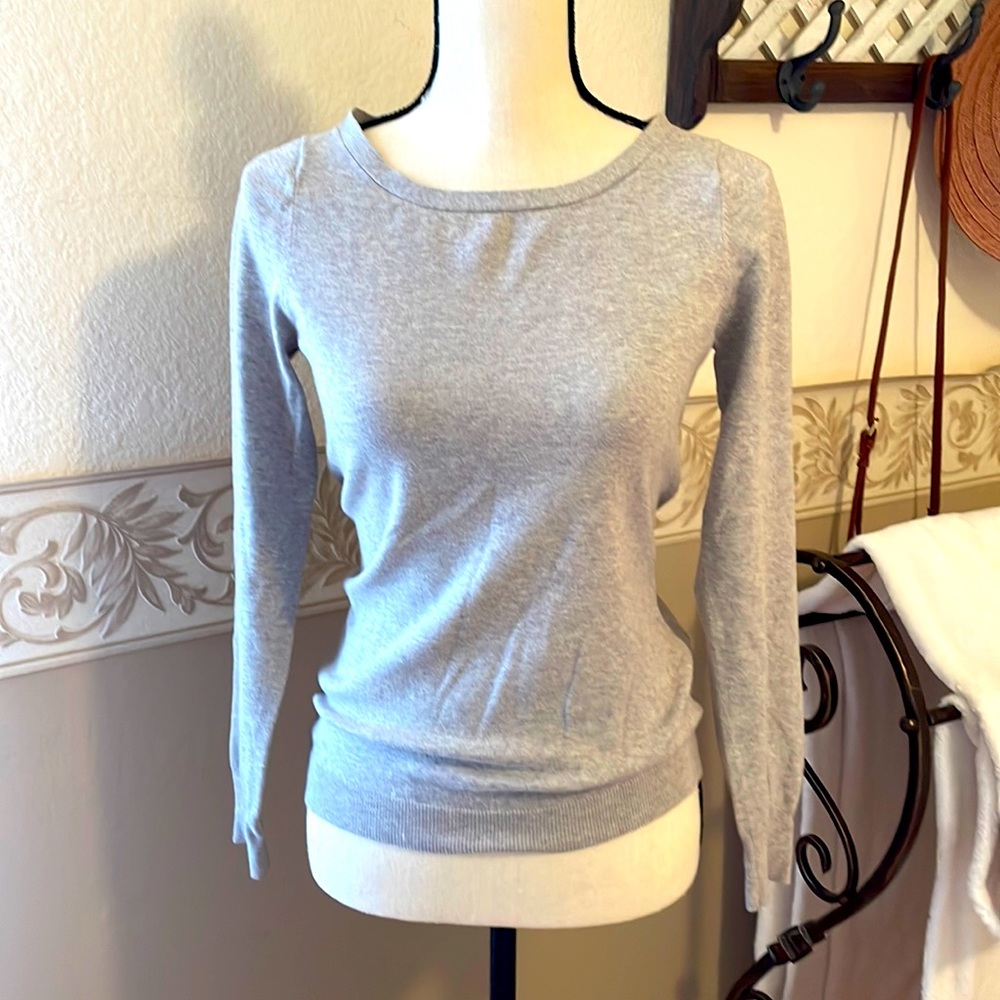 COPY - Light grey soft mixed material w/hot pink ribbon detail zipper in back.